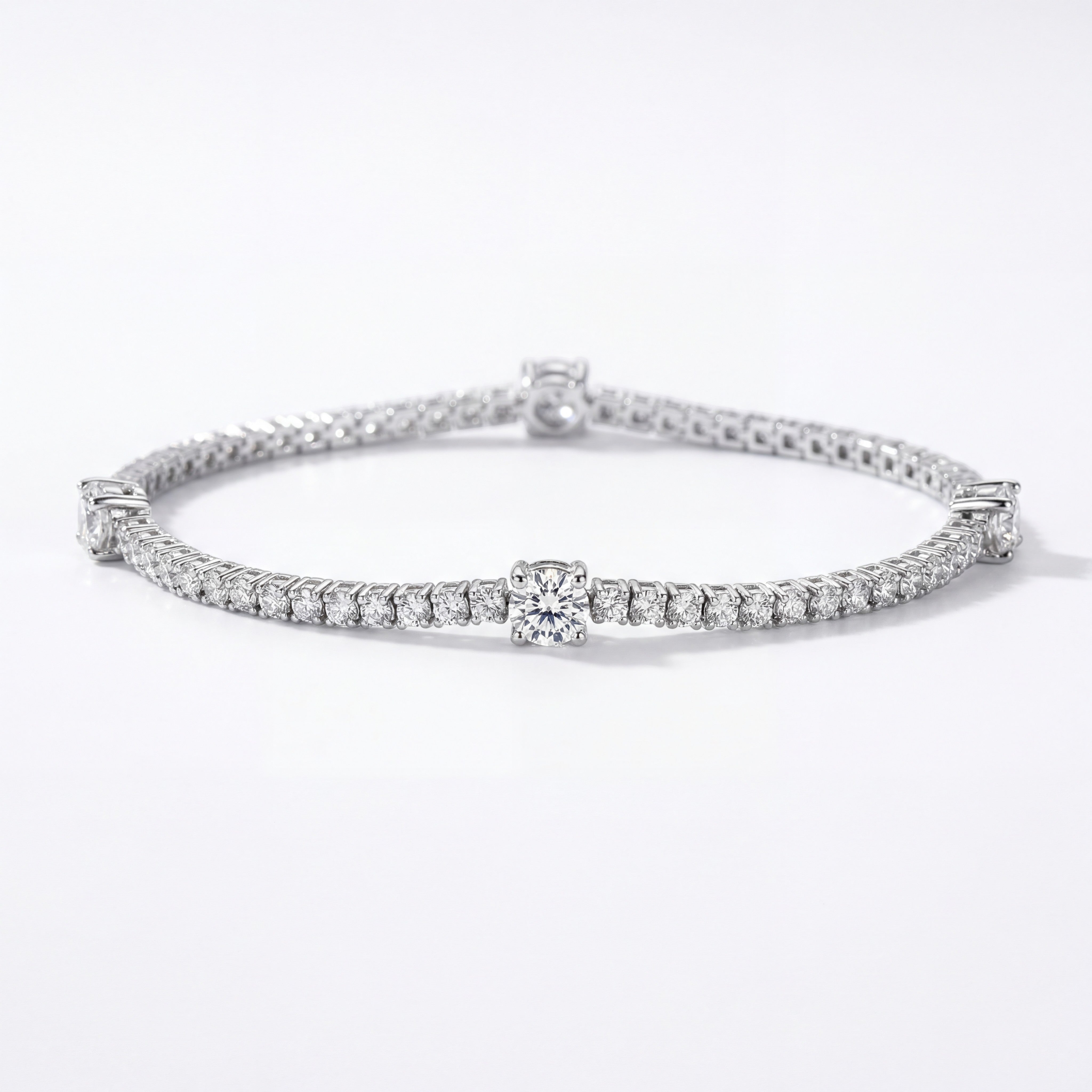 Aureline Couronne de Clarté tennis bracelet in sterling silver with round lab-grown Auréline Gems on white background.