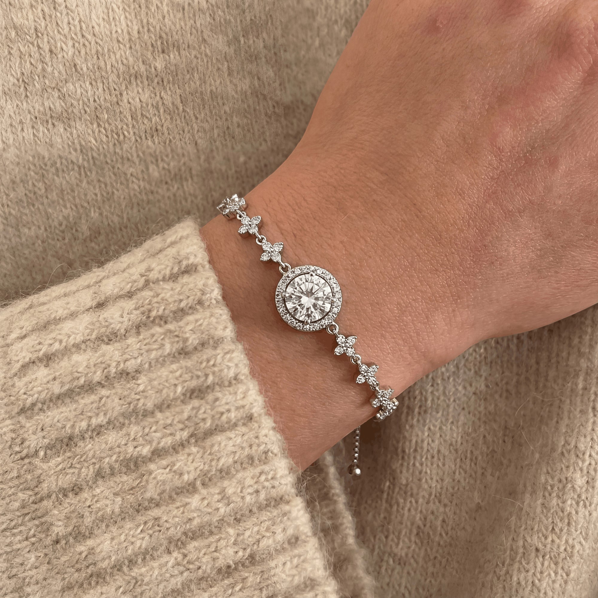 Aureline Fleur de Lune bracelet featuring a round lab-grown Auréline gem in sterling silver on a wrist.